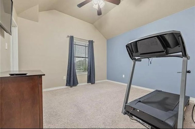 exercise room featuring light colored carpet, baseboards, a ceiling fan, and vaulted ceiling