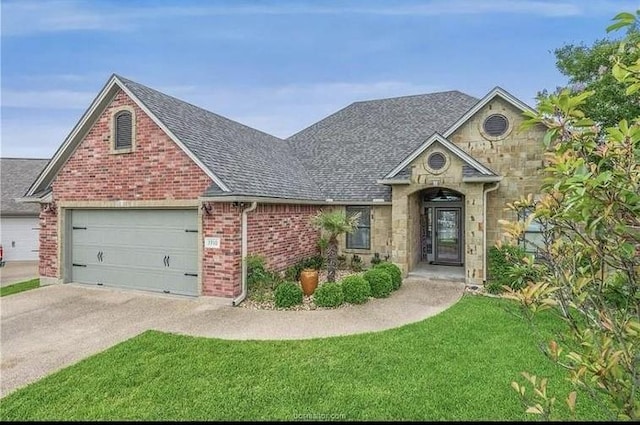 view of front of property with brick siding, stone siding, driveway, and a front lawn