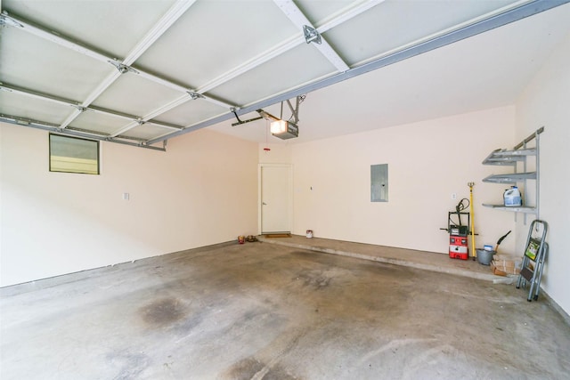 garage with electric panel and a garage door opener