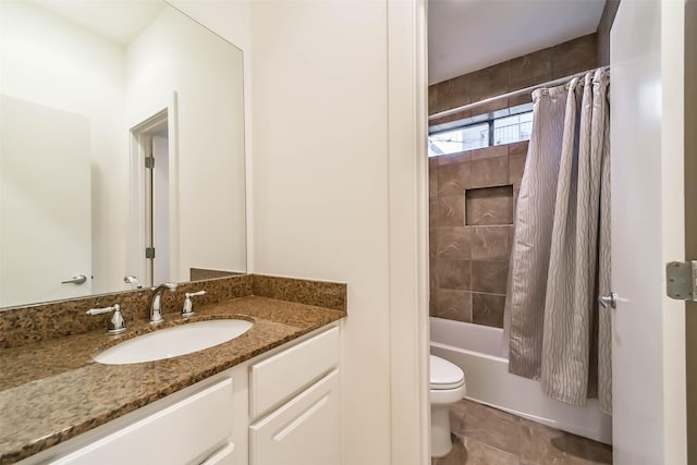 bathroom featuring vanity, toilet, tile patterned flooring, and shower / tub combo with curtain