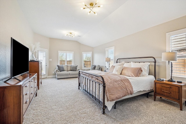 bedroom featuring light colored carpet, baseboards, and vaulted ceiling