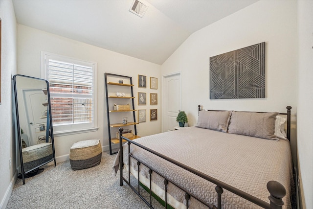 bedroom featuring visible vents, baseboards, carpet, and vaulted ceiling