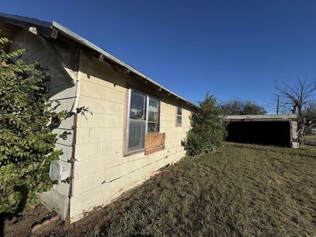 view of side of property featuring concrete block siding