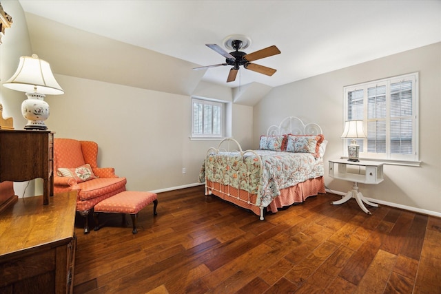 bedroom featuring hardwood / wood-style flooring, a ceiling fan, baseboards, and vaulted ceiling