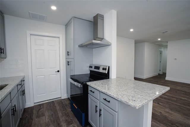 kitchen featuring wall chimney range hood, electric stove, visible vents, and dark wood-style flooring