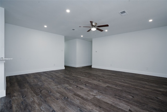 empty room with dark wood-type flooring, recessed lighting, visible vents, and ceiling fan