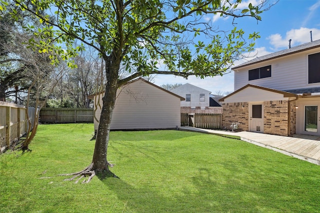 view of yard with a fenced backyard