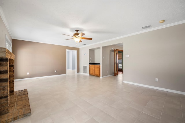 unfurnished living room with ornamental molding, a ceiling fan, visible vents, and baseboards