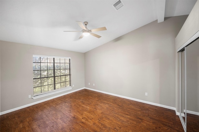 unfurnished bedroom with vaulted ceiling with beams, baseboards, and visible vents