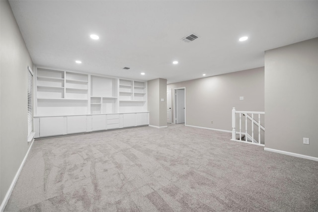 spare room featuring visible vents, recessed lighting, and baseboards