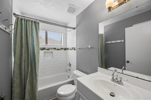 bathroom featuring visible vents, shower / tub combo with curtain, toilet, a textured ceiling, and a textured wall