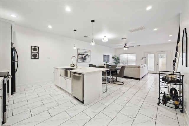 kitchen featuring visible vents, ceiling fan, a sink, appliances with stainless steel finishes, and marble finish floor