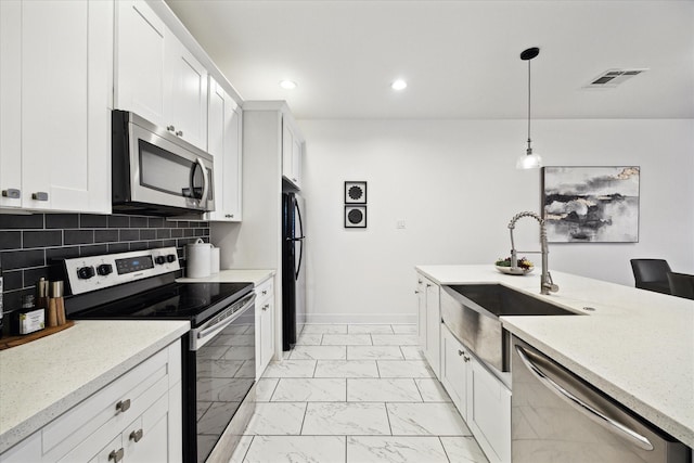 kitchen with visible vents, decorative backsplash, marble finish floor, stainless steel appliances, and a sink