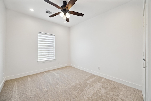 empty room with visible vents, baseboards, light colored carpet, recessed lighting, and a ceiling fan