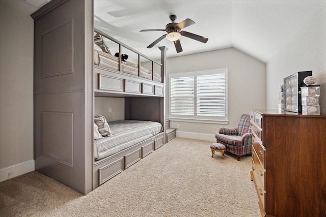 carpeted bedroom featuring ceiling fan, baseboards, and lofted ceiling