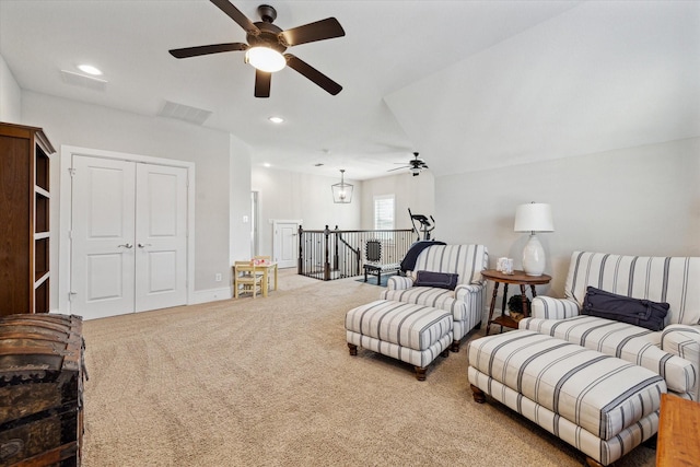 living room with recessed lighting, a ceiling fan, and carpet flooring