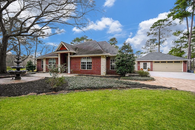 view of front of house featuring a front yard, a garage, brick siding, and driveway