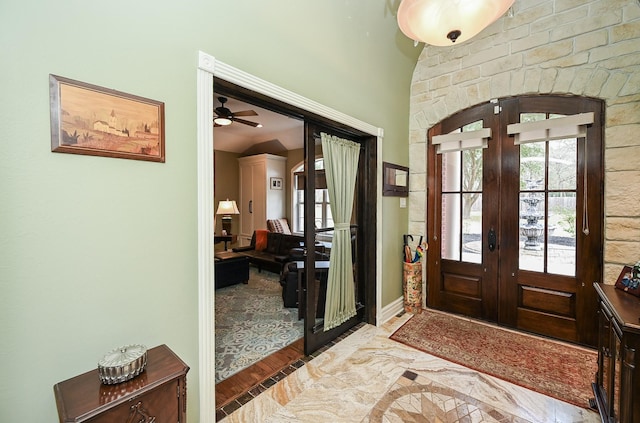 entryway featuring wood finished floors, a healthy amount of sunlight, and french doors