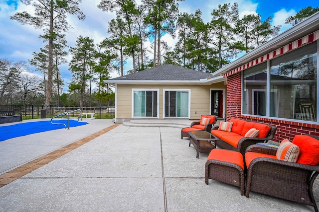 view of patio / terrace featuring an outdoor hangout area and fence