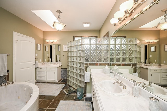 full bathroom with two vanities, a sink, a jetted tub, a skylight, and walk in shower