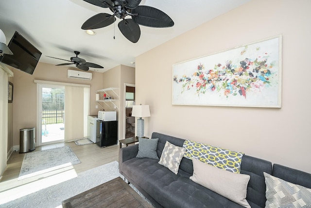 living room with a wall mounted air conditioner, wood finished floors, and a ceiling fan