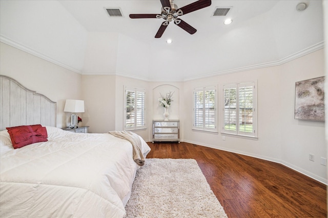 bedroom featuring visible vents, a ceiling fan, baseboards, and wood finished floors