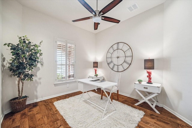 office area featuring wood finished floors, a ceiling fan, visible vents, and baseboards