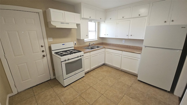 kitchen with white appliances, light tile patterned flooring, a sink, white cabinets, and under cabinet range hood