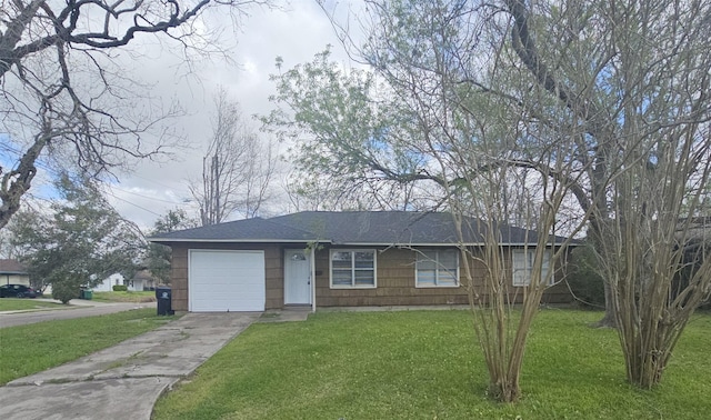 single story home with a garage, concrete driveway, a front yard, and a shingled roof