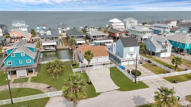 aerial view featuring a residential view and a water view