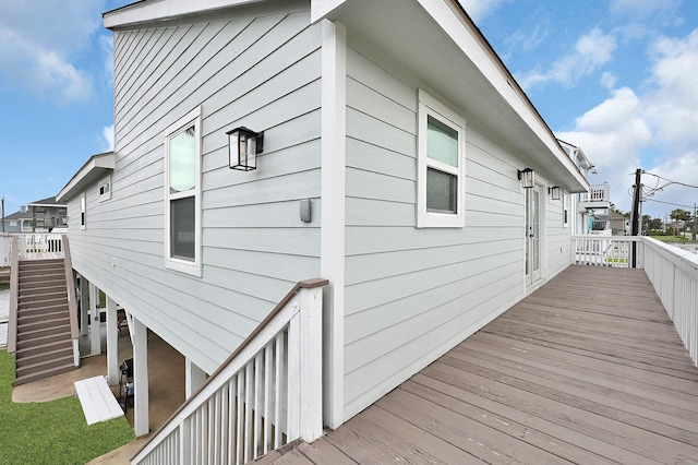 wooden deck featuring stairs