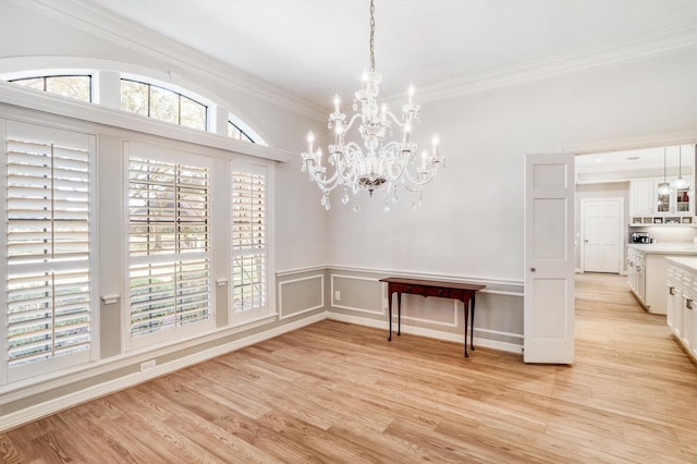 unfurnished dining area featuring a chandelier and light wood-type flooring