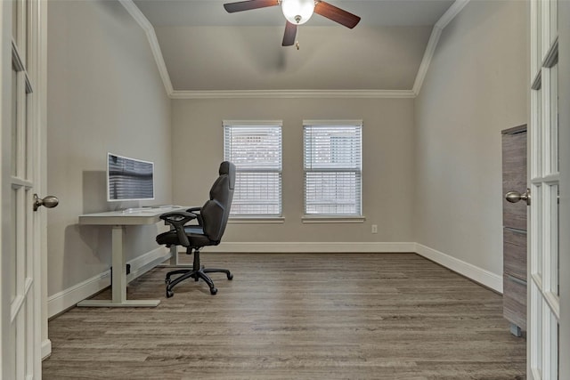 unfurnished office with baseboards, wood finished floors, ornamental molding, and a ceiling fan