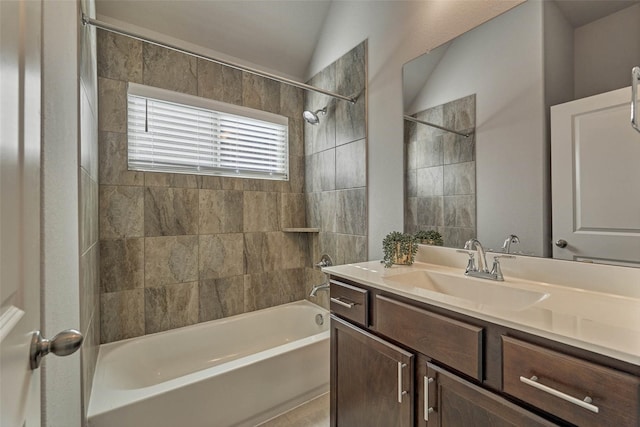 full bathroom featuring vanity, shower / bathing tub combination, and lofted ceiling