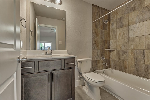 full bathroom featuring vanity,  shower combination, tile patterned flooring, toilet, and a textured wall