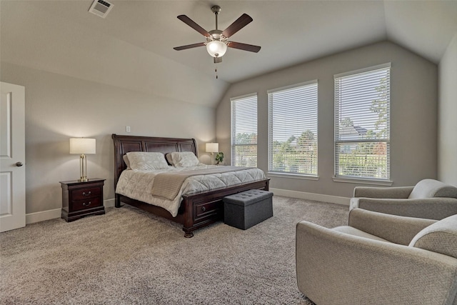 bedroom featuring visible vents, carpet floors, baseboards, and vaulted ceiling