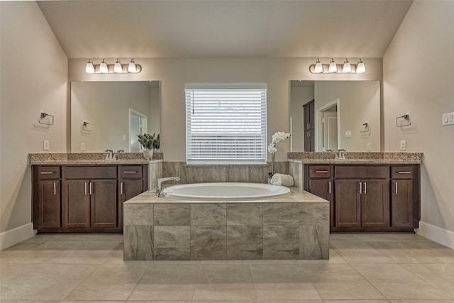 full bath with a bath, a sink, tile patterned floors, and two vanities