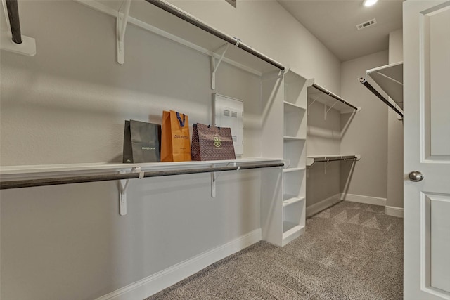 spacious closet featuring carpet flooring and visible vents