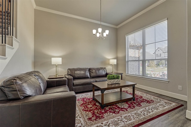 living room featuring wood finished floors, baseboards, a chandelier, and ornamental molding