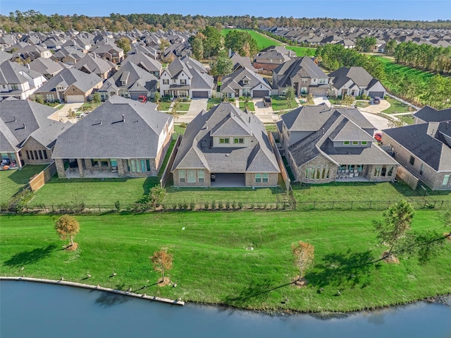 bird's eye view with a residential view and a water view