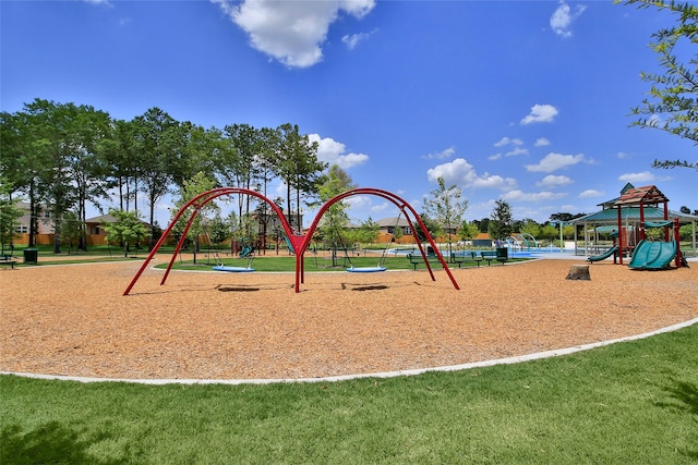 community play area featuring a lawn