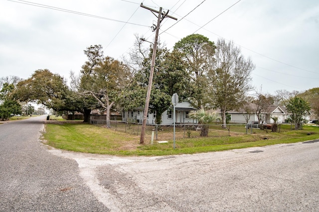 view of front of house with a fenced front yard and a front yard