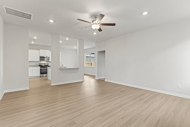 unfurnished living room with visible vents, light wood-style flooring, recessed lighting, baseboards, and ceiling fan