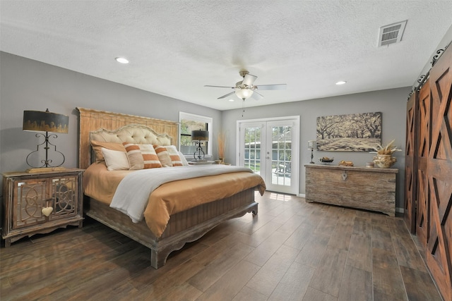 bedroom featuring visible vents, ceiling fan, dark wood-style floors, a textured ceiling, and access to outside