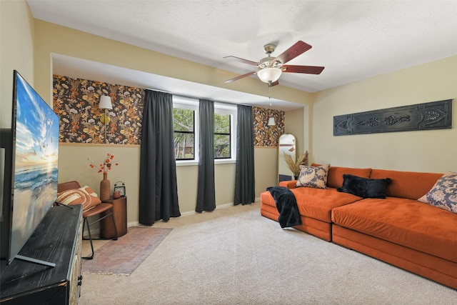 carpeted living room featuring a textured ceiling and ceiling fan