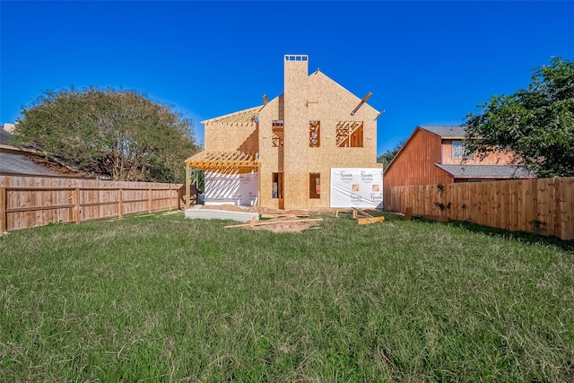 rear view of property with a lawn, a pergola, a fenced backyard, and stucco siding