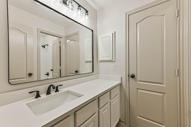 bathroom with a shower and vanity