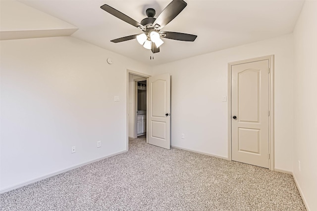 unfurnished bedroom with baseboards, light colored carpet, and ceiling fan