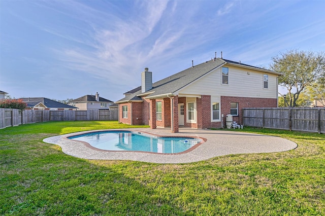 view of pool with a patio, a yard, a fenced backyard, and a fenced in pool