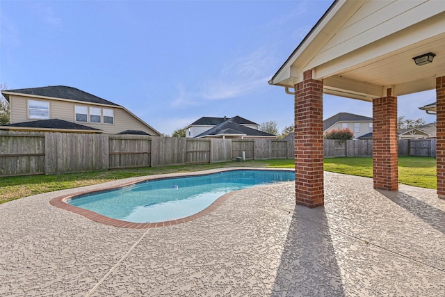 view of pool with a patio area, a lawn, a fenced in pool, and a fenced backyard